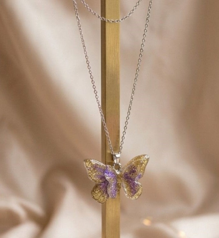 Double Butterfly Resin Necklace – Gold & Silver Sparkle with Lilac Touch
