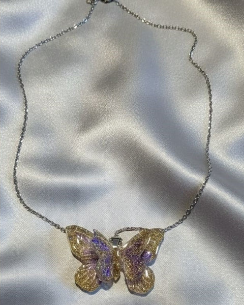 Double Butterfly Resin Necklace – Gold & Silver Sparkle with Lilac Touch